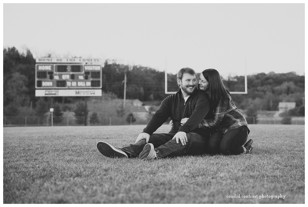 football field engagement photos, bellevue ia wedding photographer, candid contrast