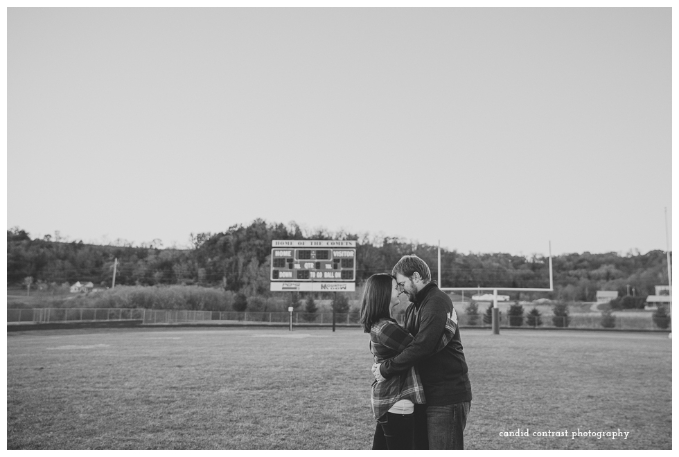 football field engagement photos, bellevue ia wedding photographer, candid contrast