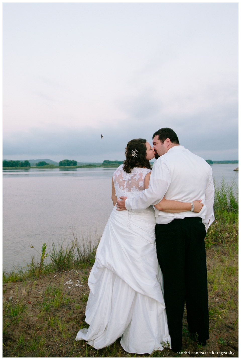 candid contrast photography, bride and groom by mississippi at sunset bellevue ia wedding