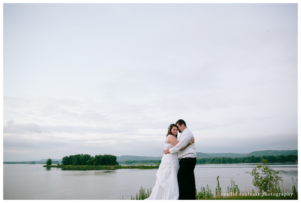 candid contrast photography, bride and groom by mississippi at sunset bellevue ia wedding