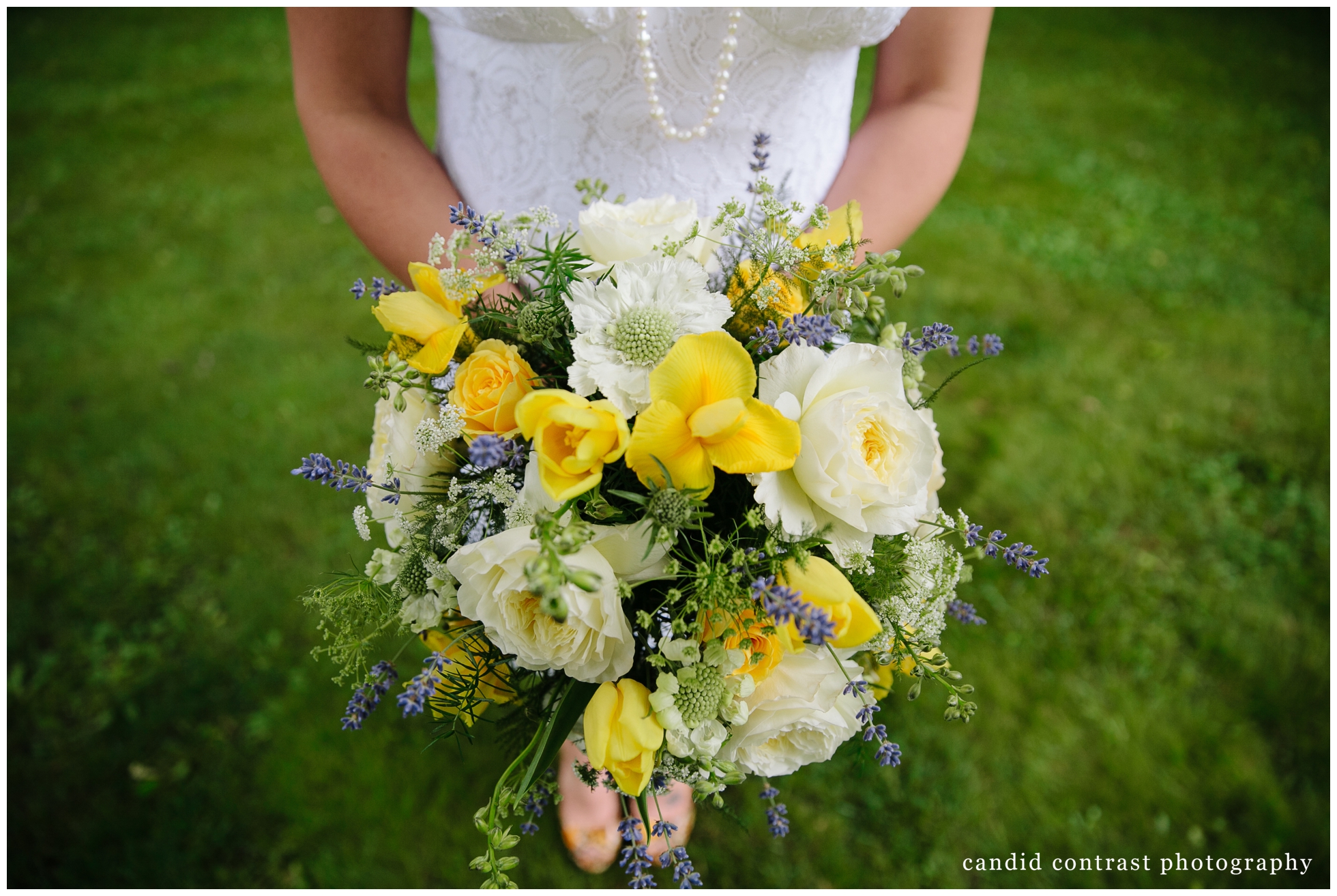 yellow and purple bridal bouquet at backyard wedding in dubuque, ia, candid contrast photography