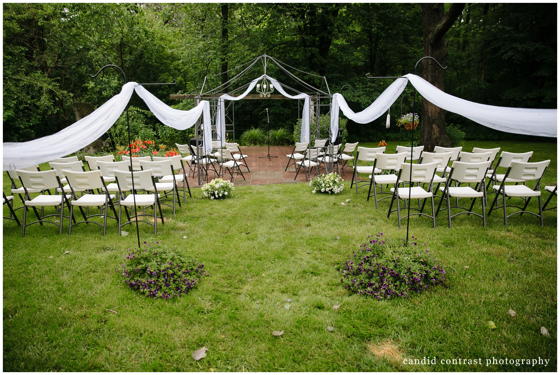 outdoor ceremony setup at backyard wedding in dubuque, ia, candid contrast photography
