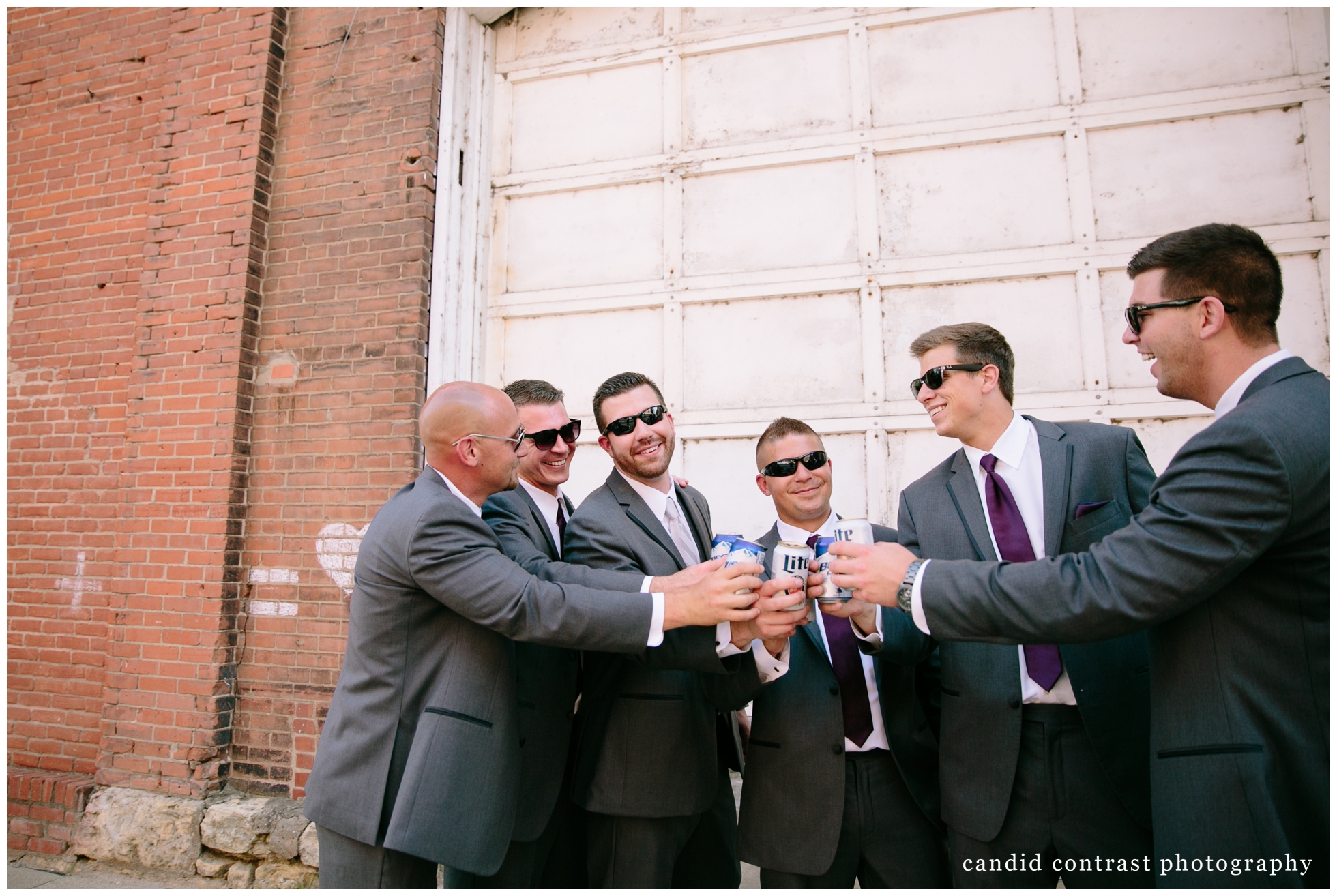 dubuque ia wedding portraits in the millwork district , candid contrast photography 