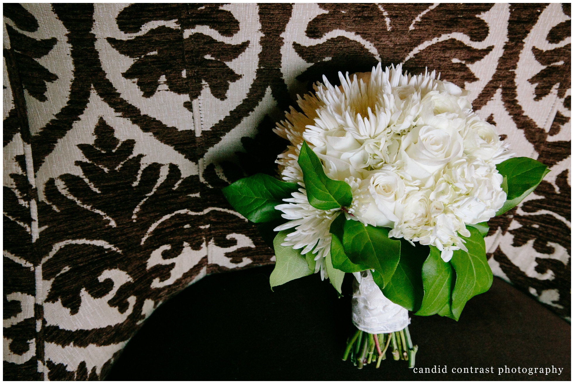 bride's bouquet at dubuque ia wedding reception at the hotel julien , candid contrast photography 