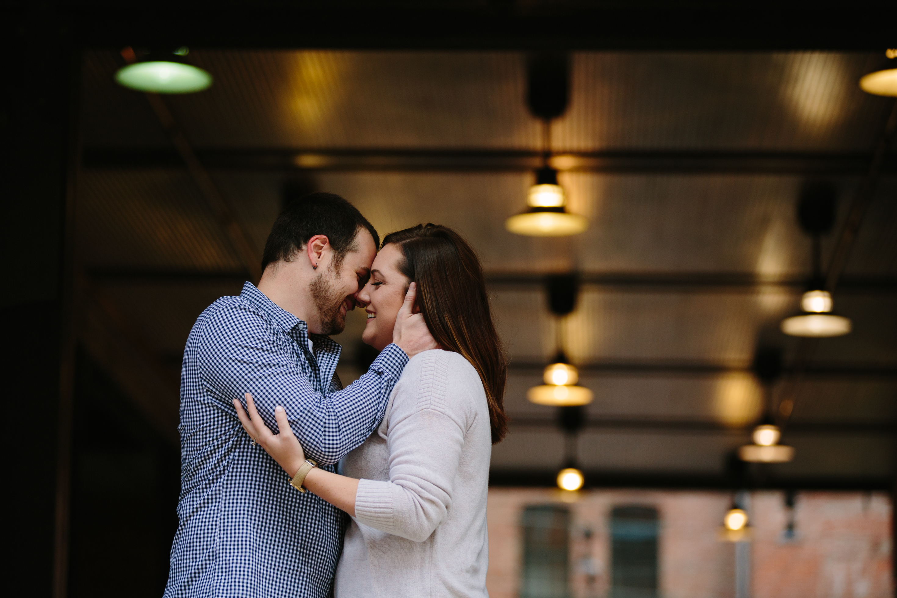 dubuque engagement session by catherine furlin photography, couple having fun in millwork district