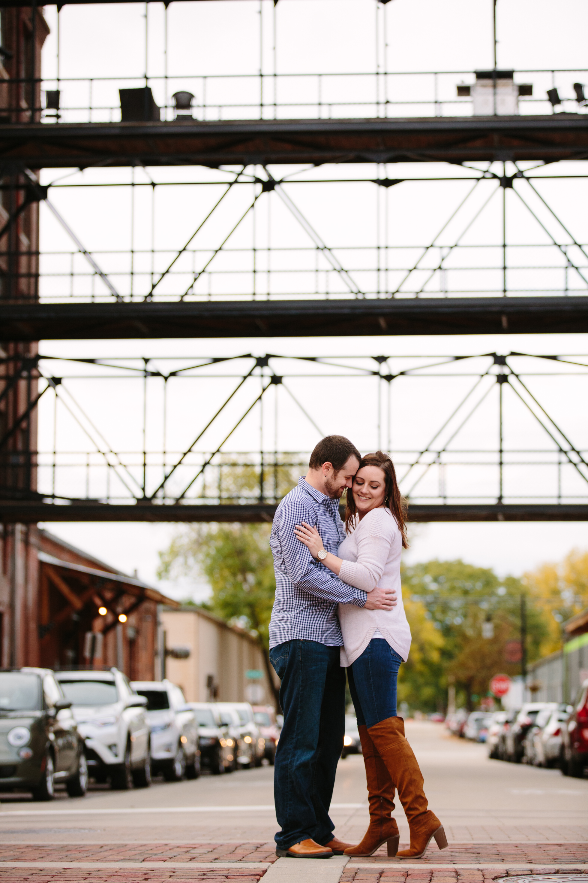 dubuque engagement session by catherine furlin photography, couple having fun in millwork district