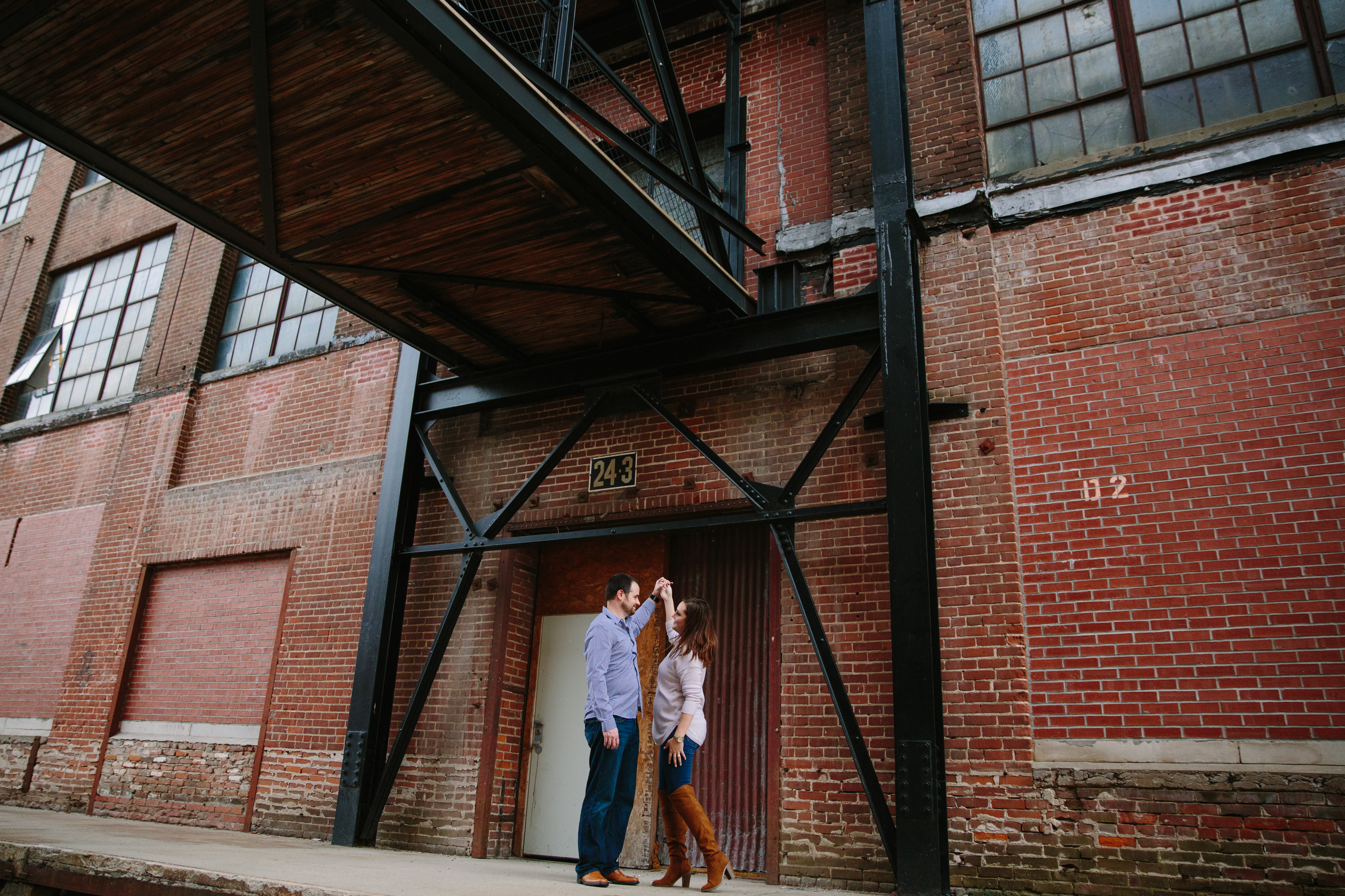dubuque engagement session by catherine furlin photography, couple dancing in millwork district