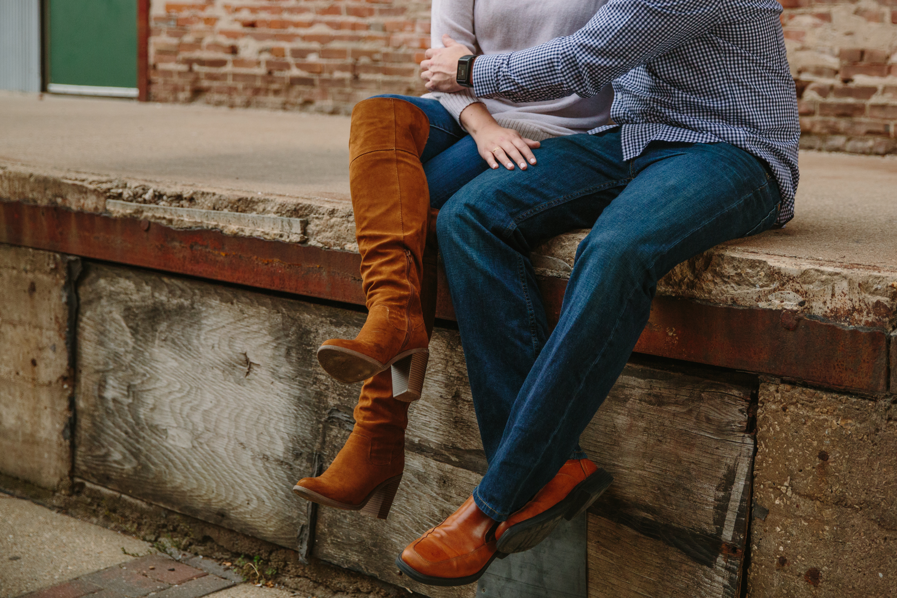 dubuque engagement session by catherine furlin photography, couple sitting in millwork district