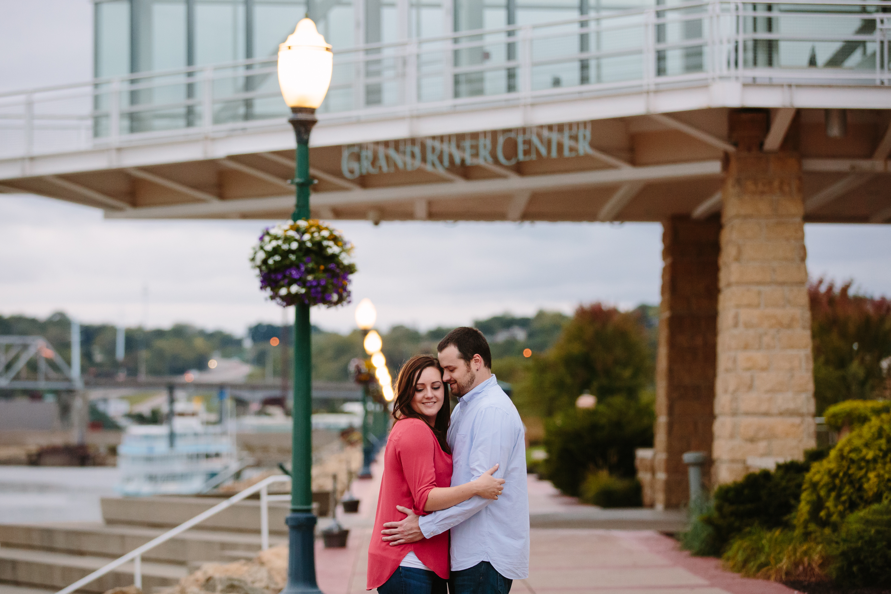 dubuque engagement session by catherine furlin photography, couple snuggling in Port of Dubuque on Mississippi River