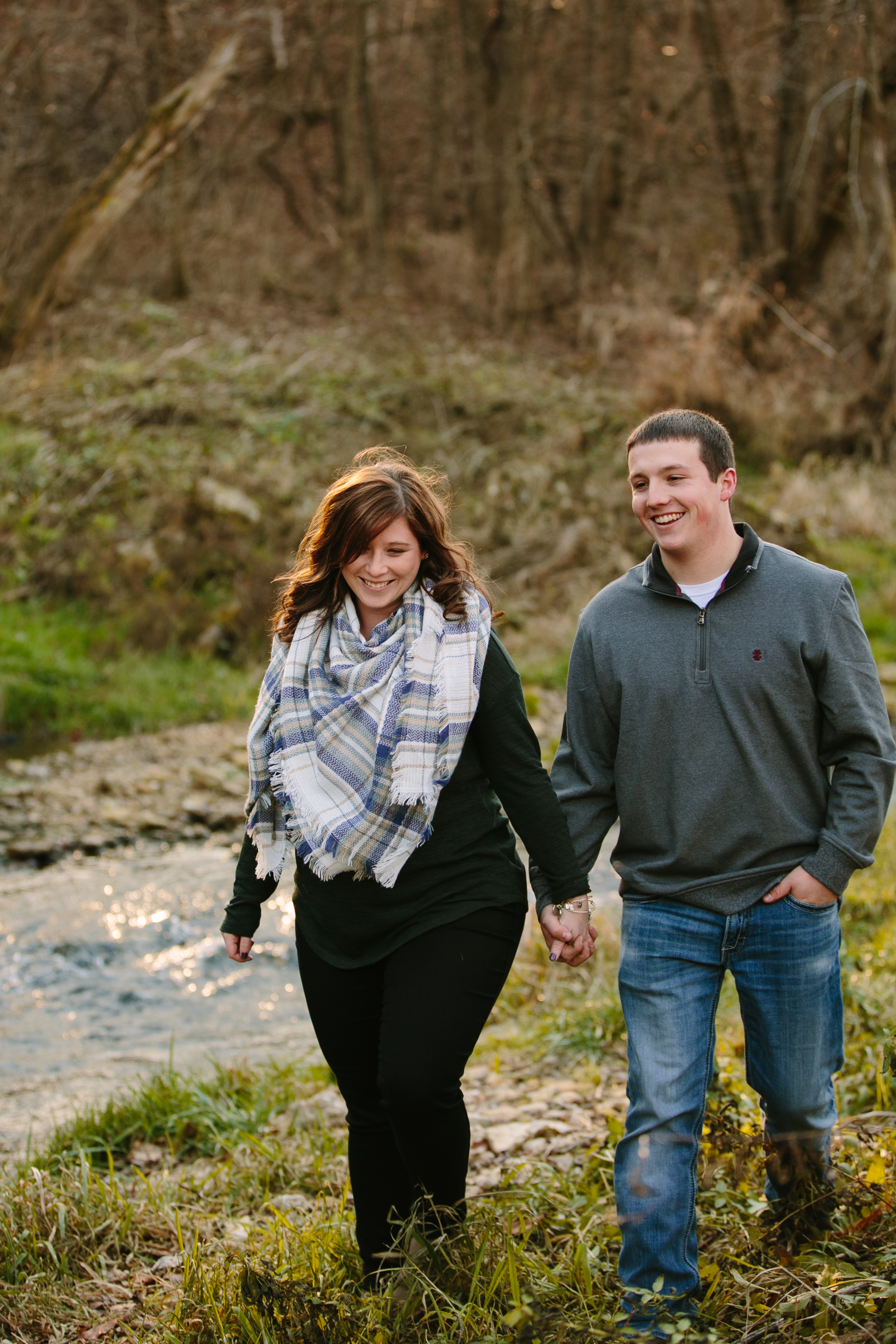 couple walking, iowa farm engagement session by catherine furlin photography