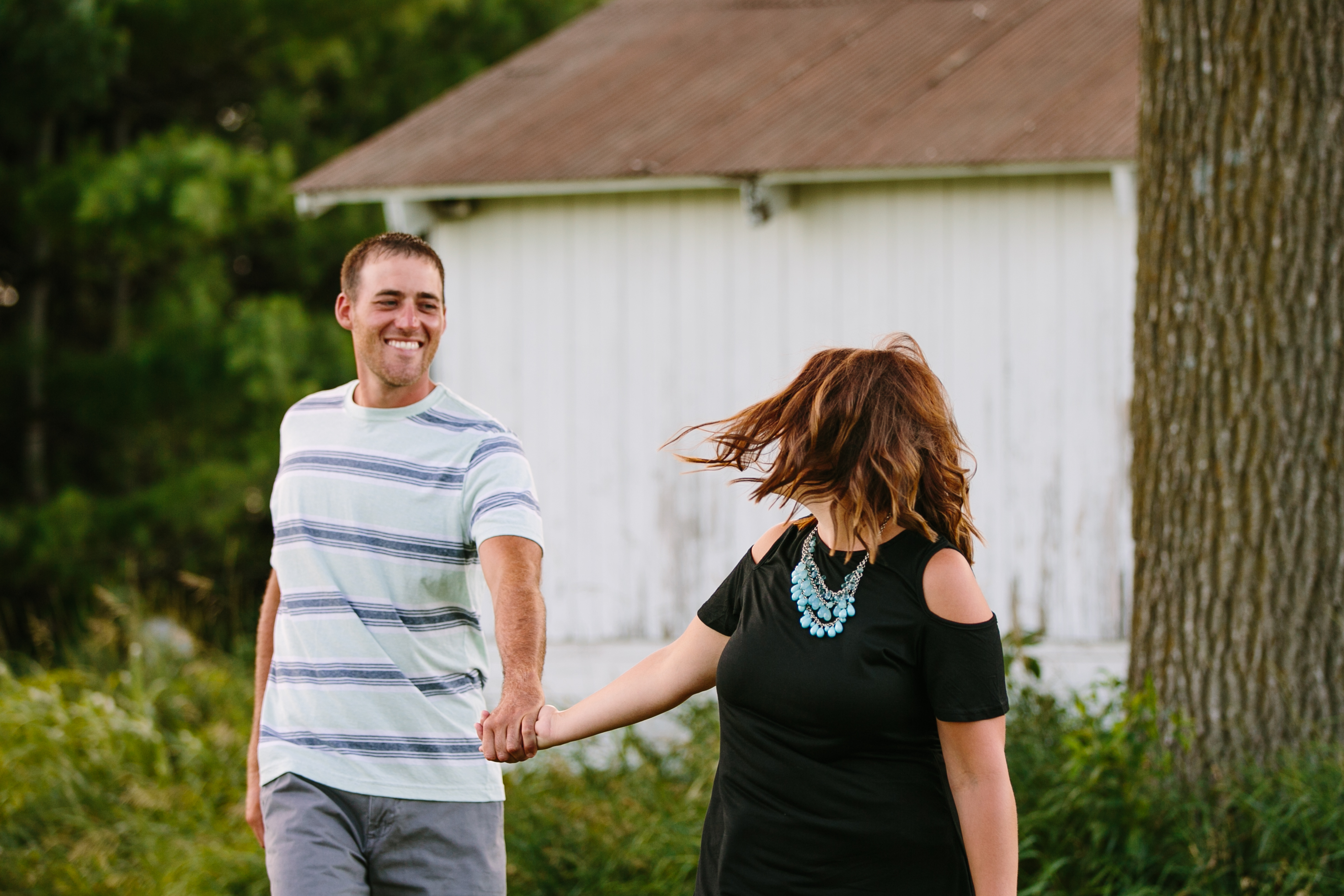 outdoor dubuque engagement session by catherine furlin photography, couple walking 
