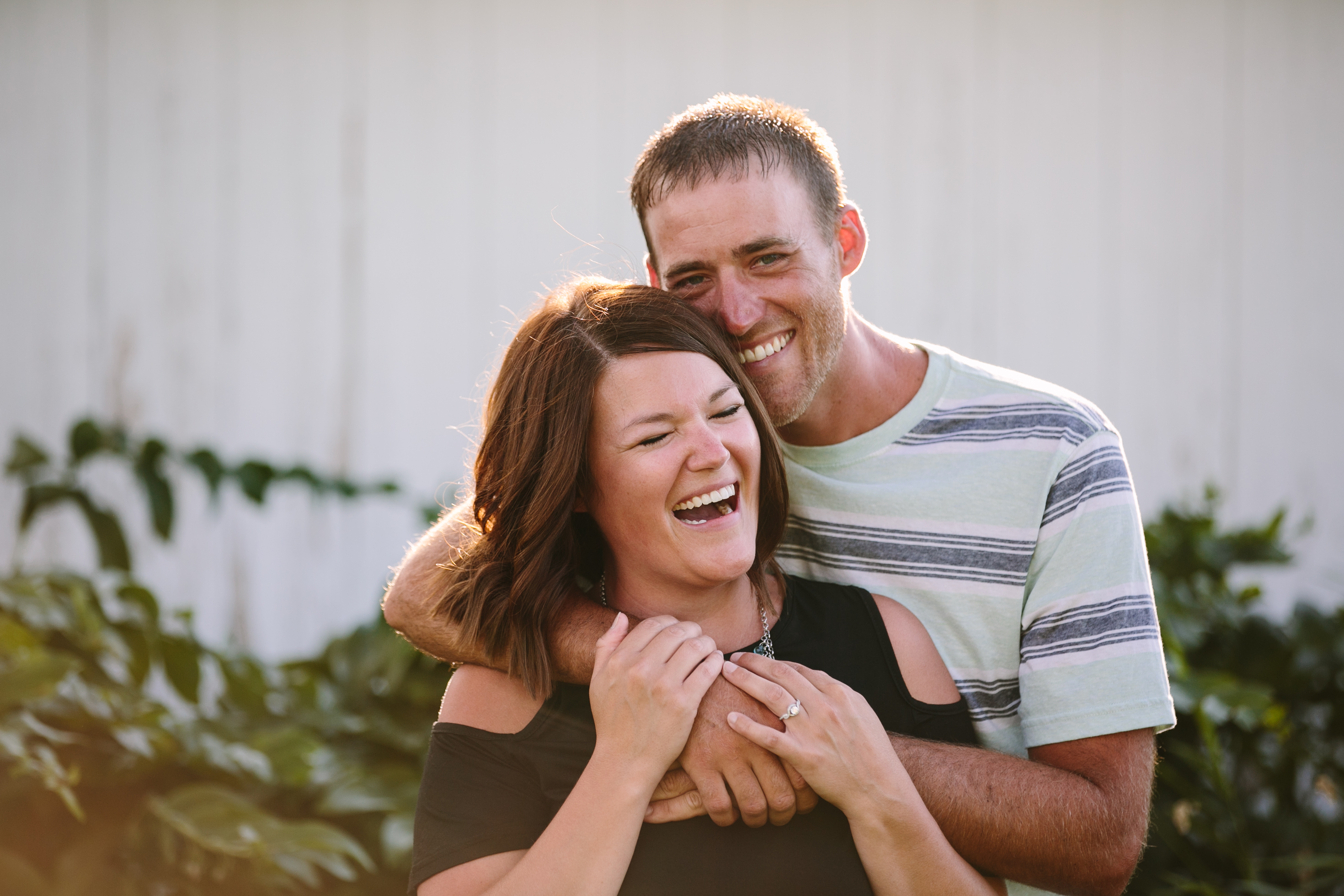 outdoor dubuque engagement session by catherine furlin photography, couple laughing 