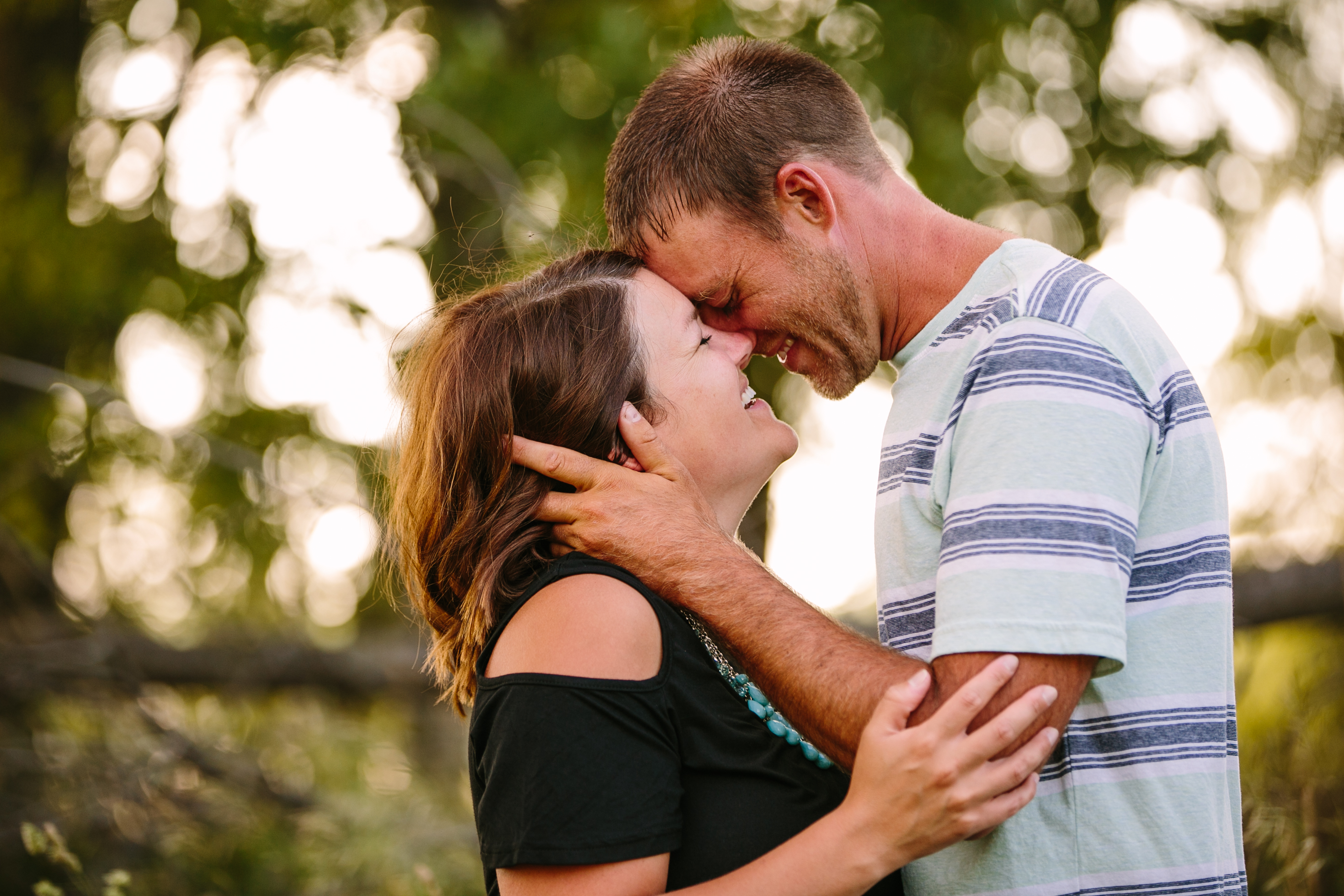 outdoor dubuque engagement session by catherine furlin photography, couple laughing