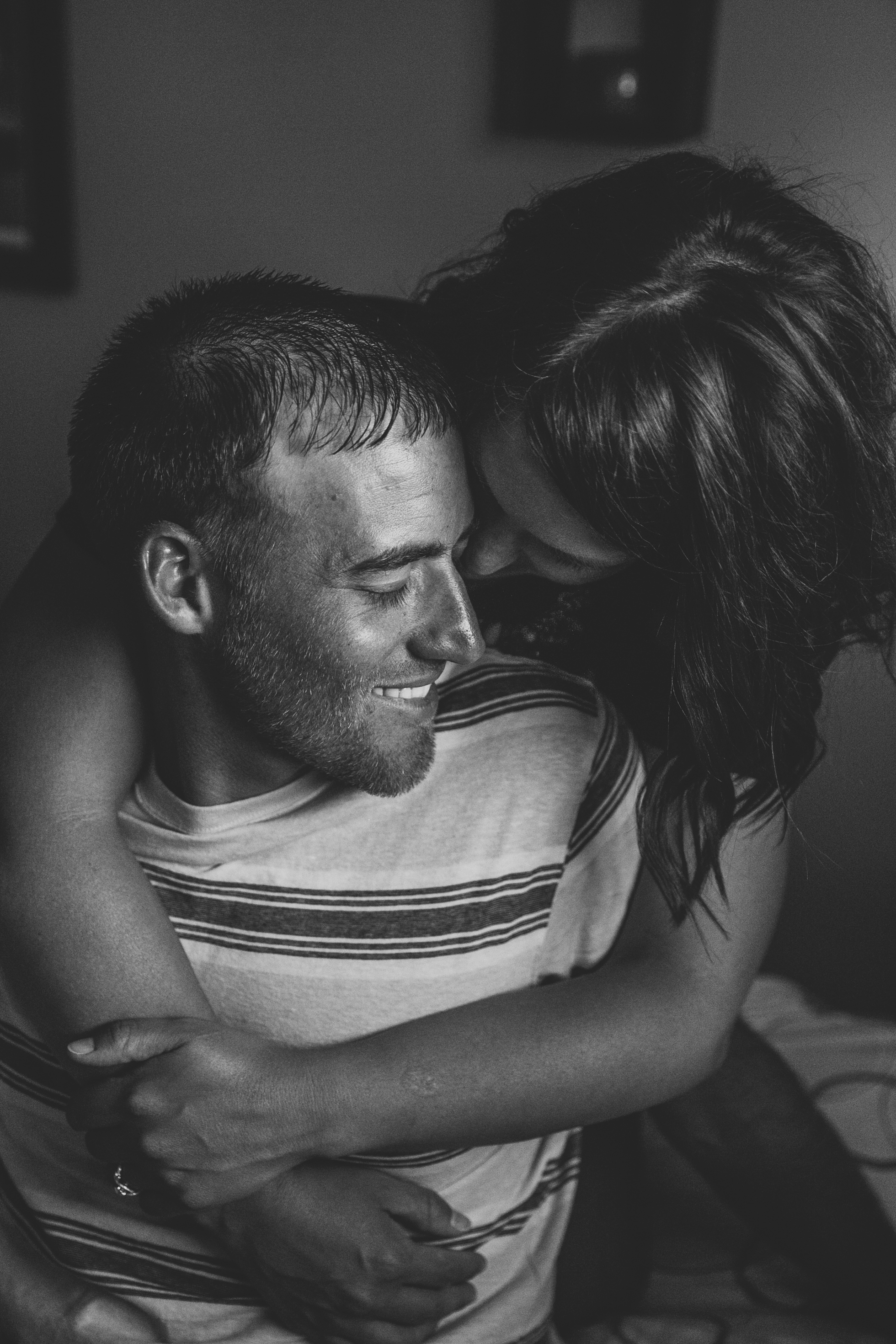 in-home dubuque engagement session by catherine furlin photography, couple sitting in bed