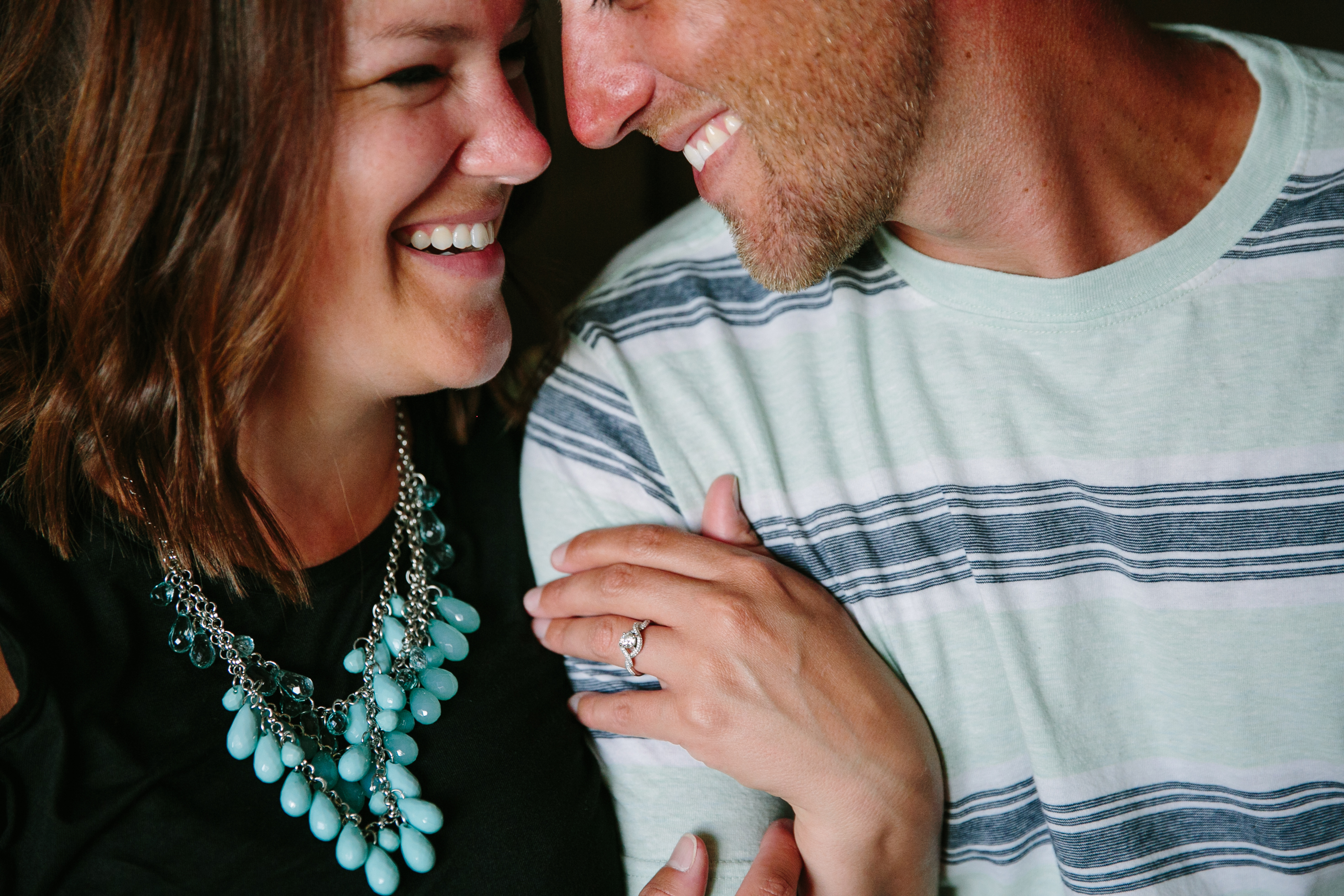 in-home dubuque engagement session by catherine furlin photography, couple snuggling on couch