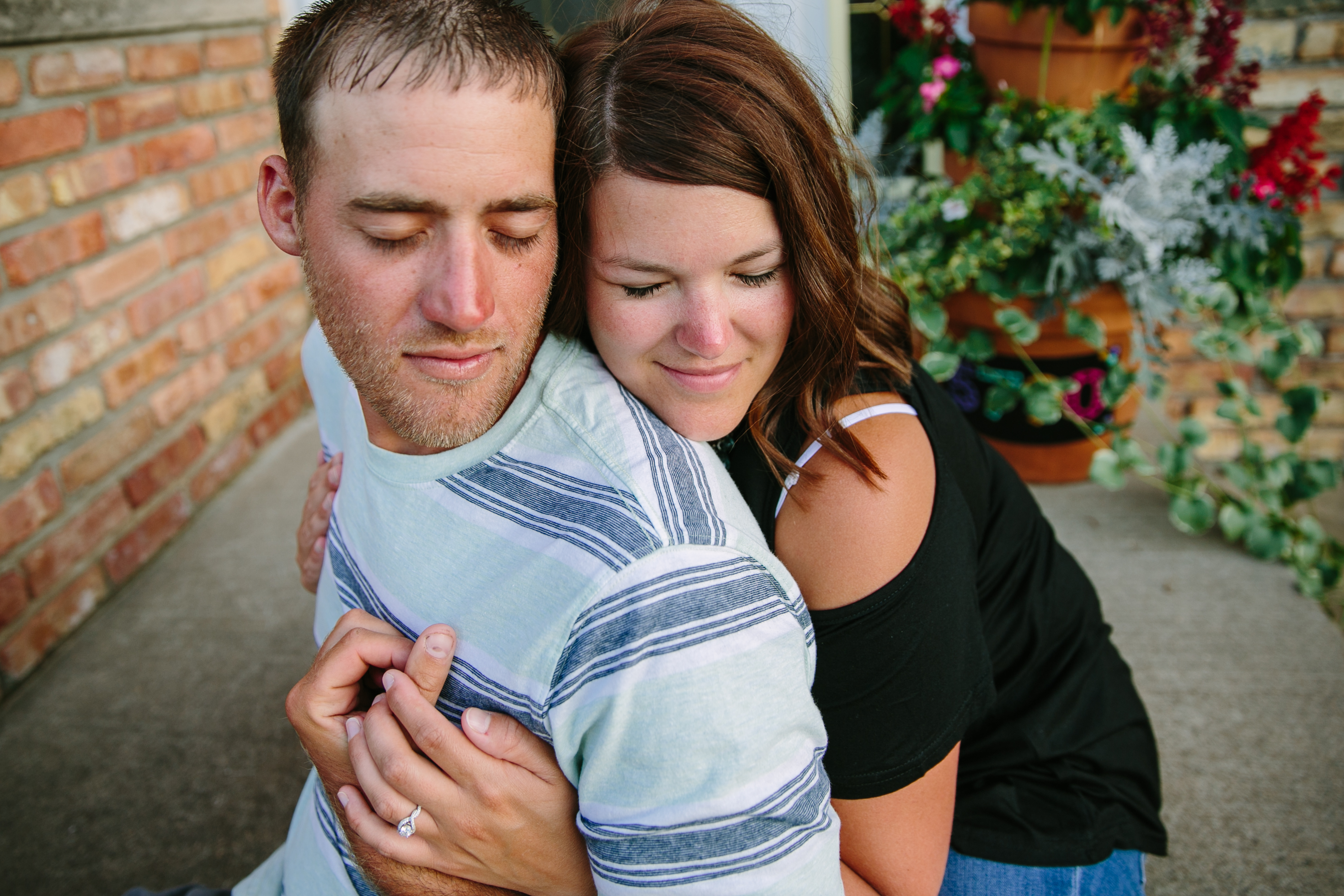 in-home dubuque engagement session by catherine furlin photography, couple sitting on front steps