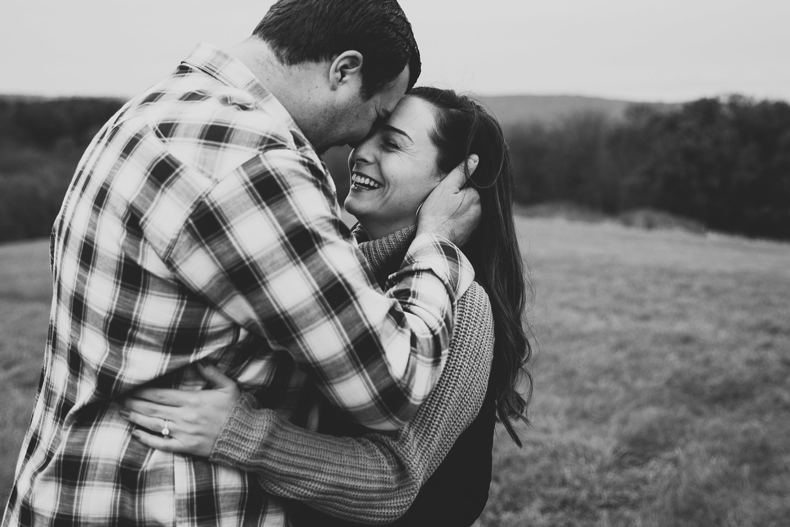 iowa couple snuggles together during engagement session