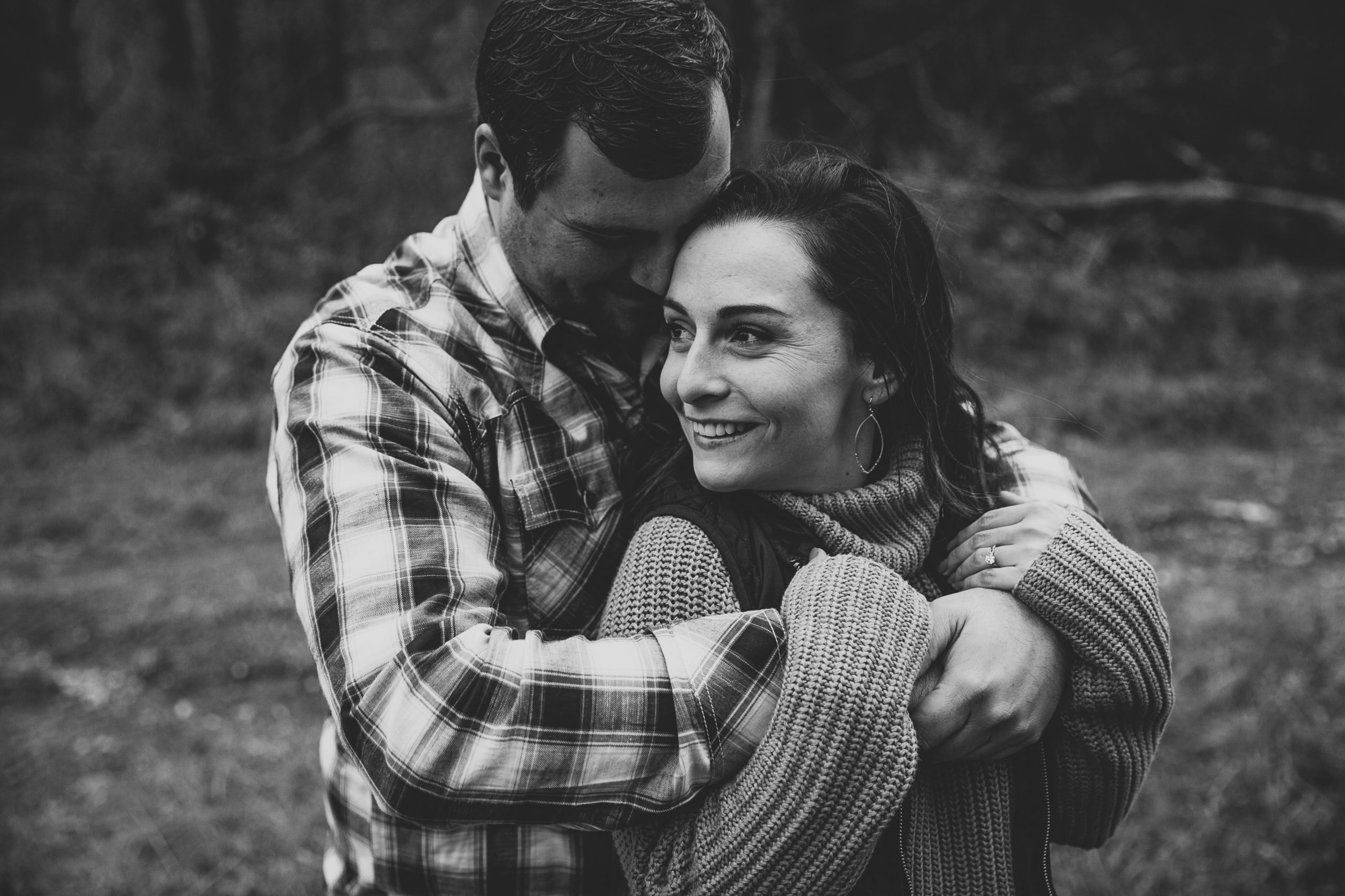 iowa couple wraps arms around each other during engagement photos