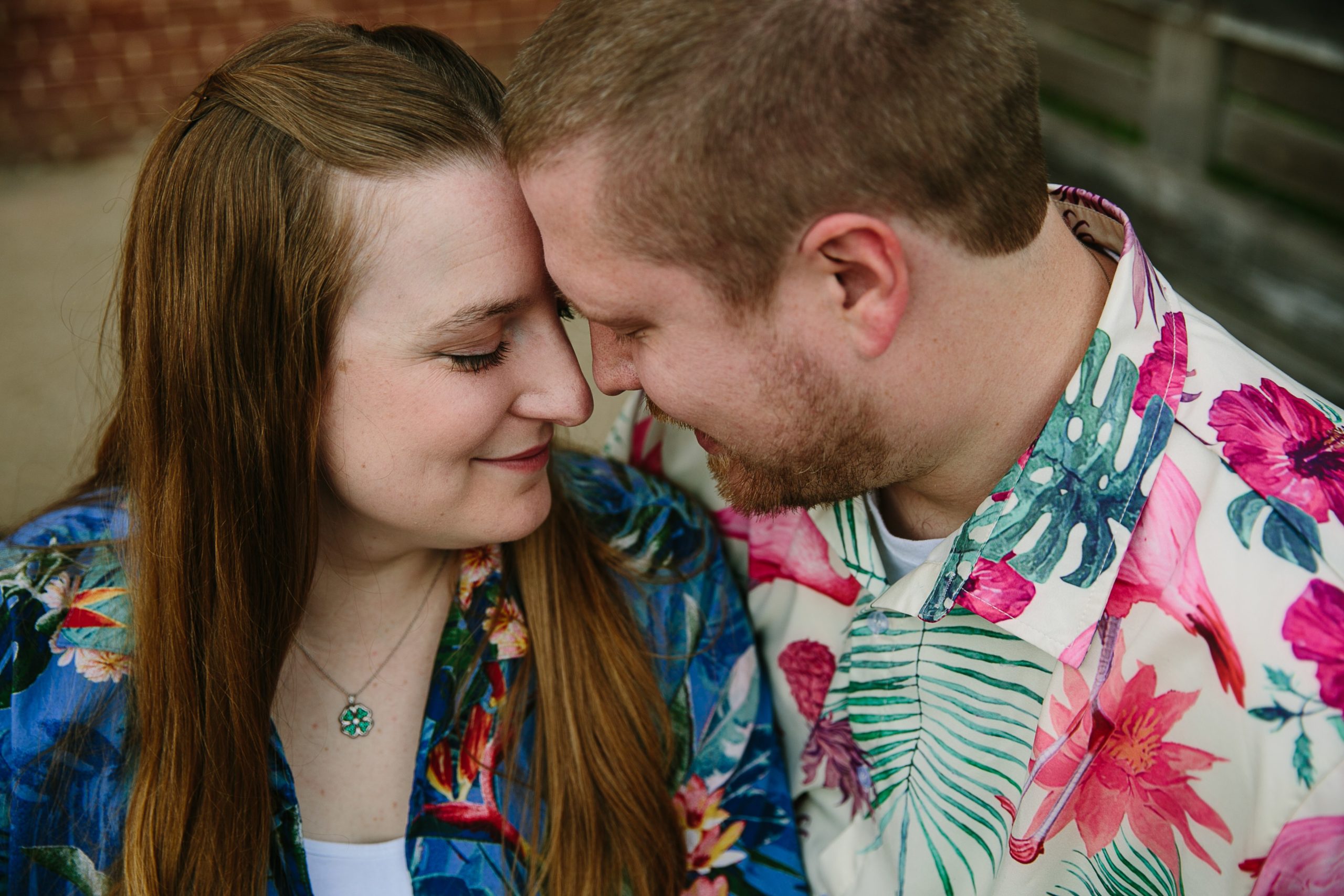 couple in hawaiian shirt snuggling up together