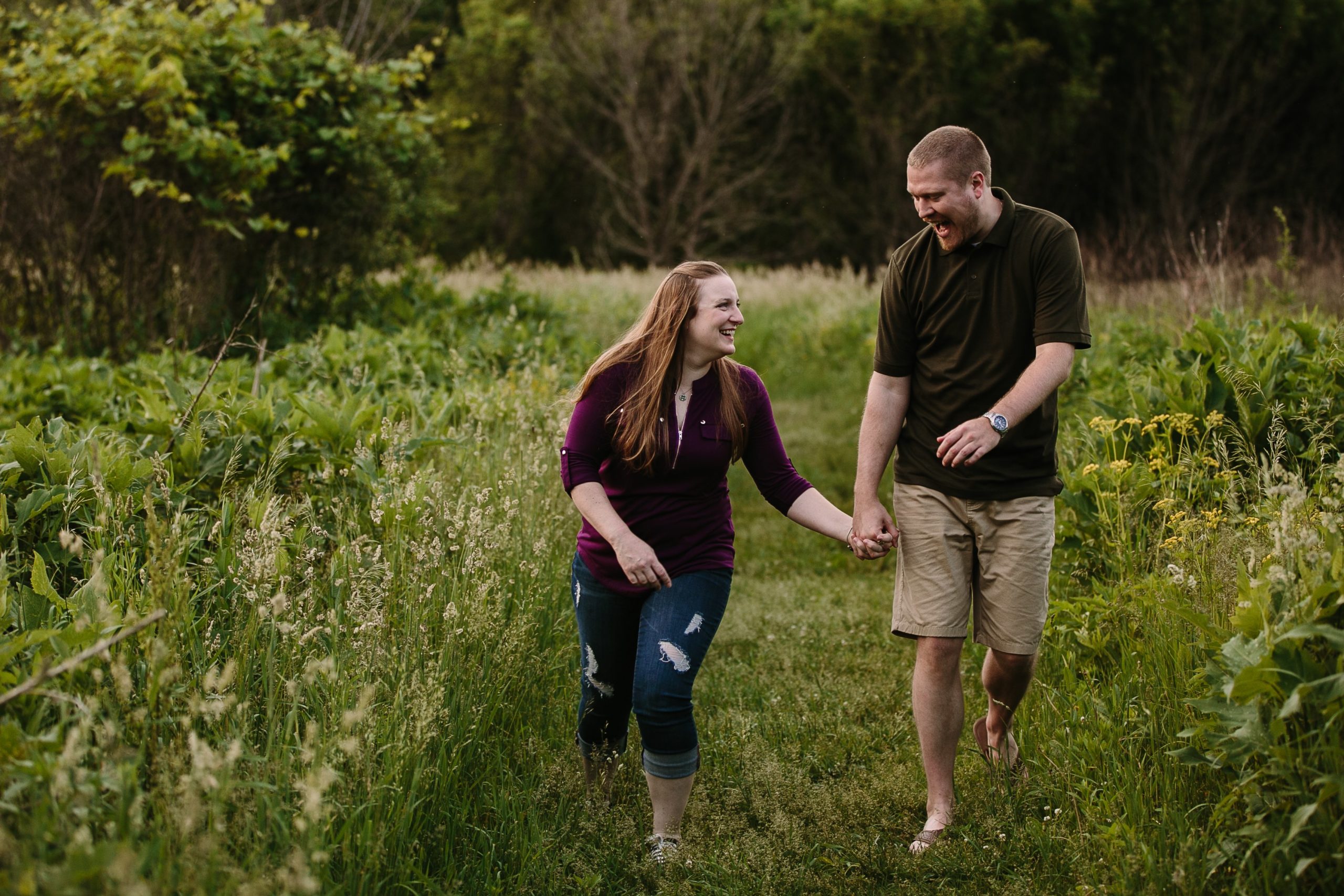 couple being silly together during dubuque engagement session at the mines of spain