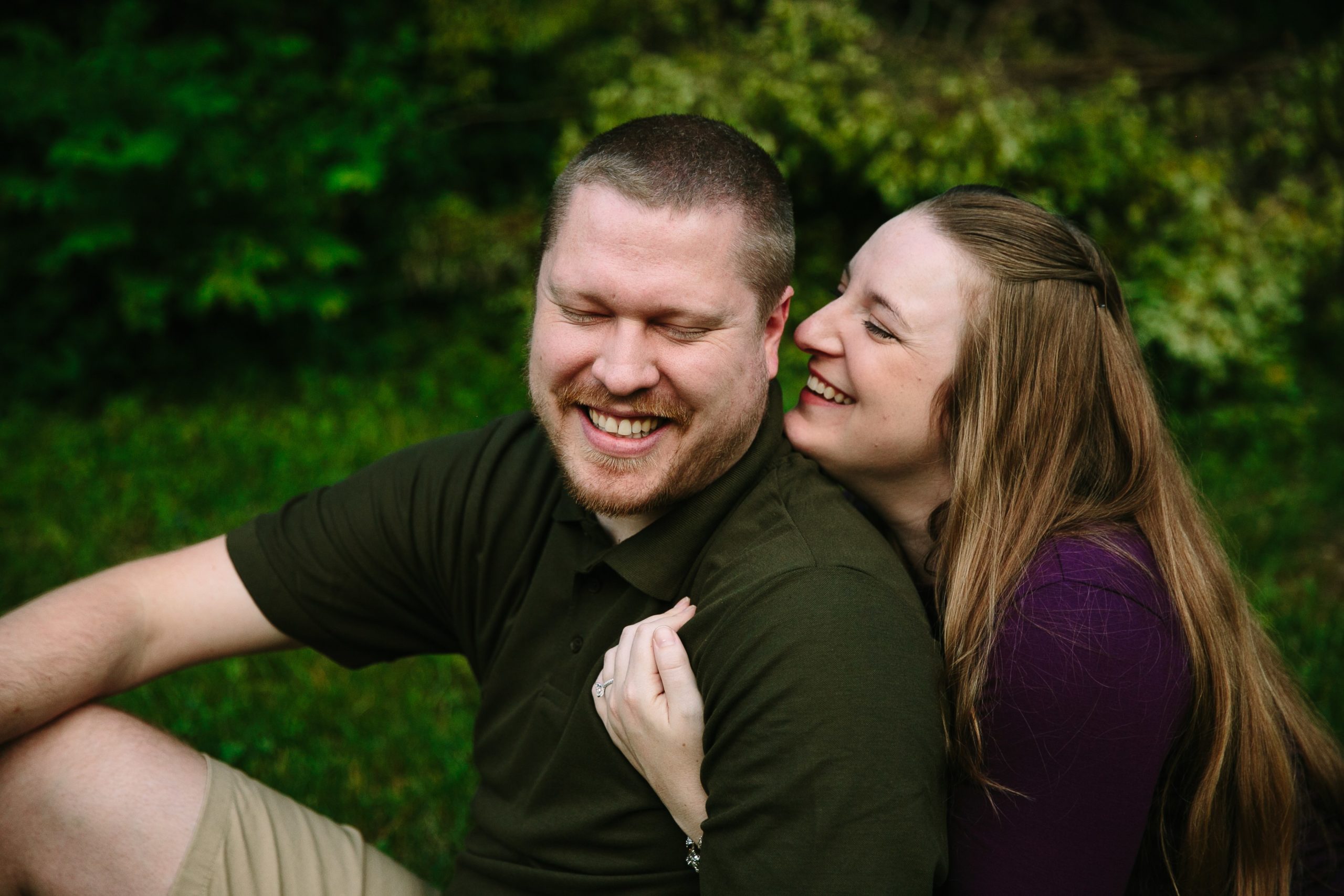couple talking during engagement photos in dubuque iowa