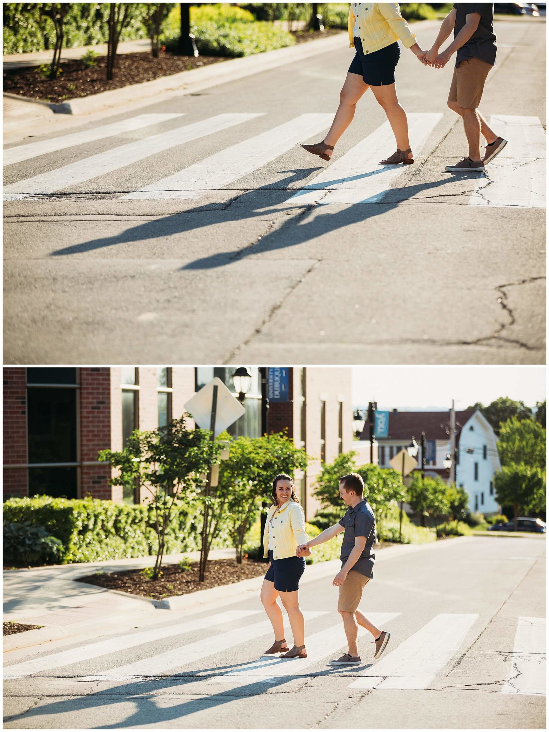 couple crossing the street during engagement photos at the university of dubuque
