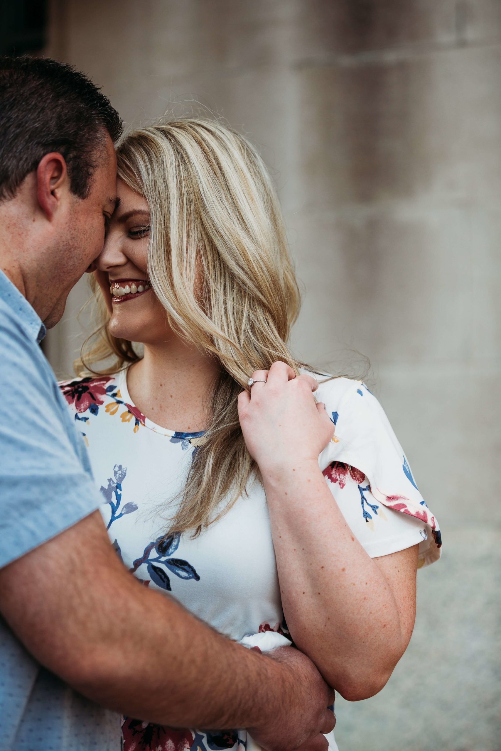 close up of a couple snuggling during downtown dubuque engagement session