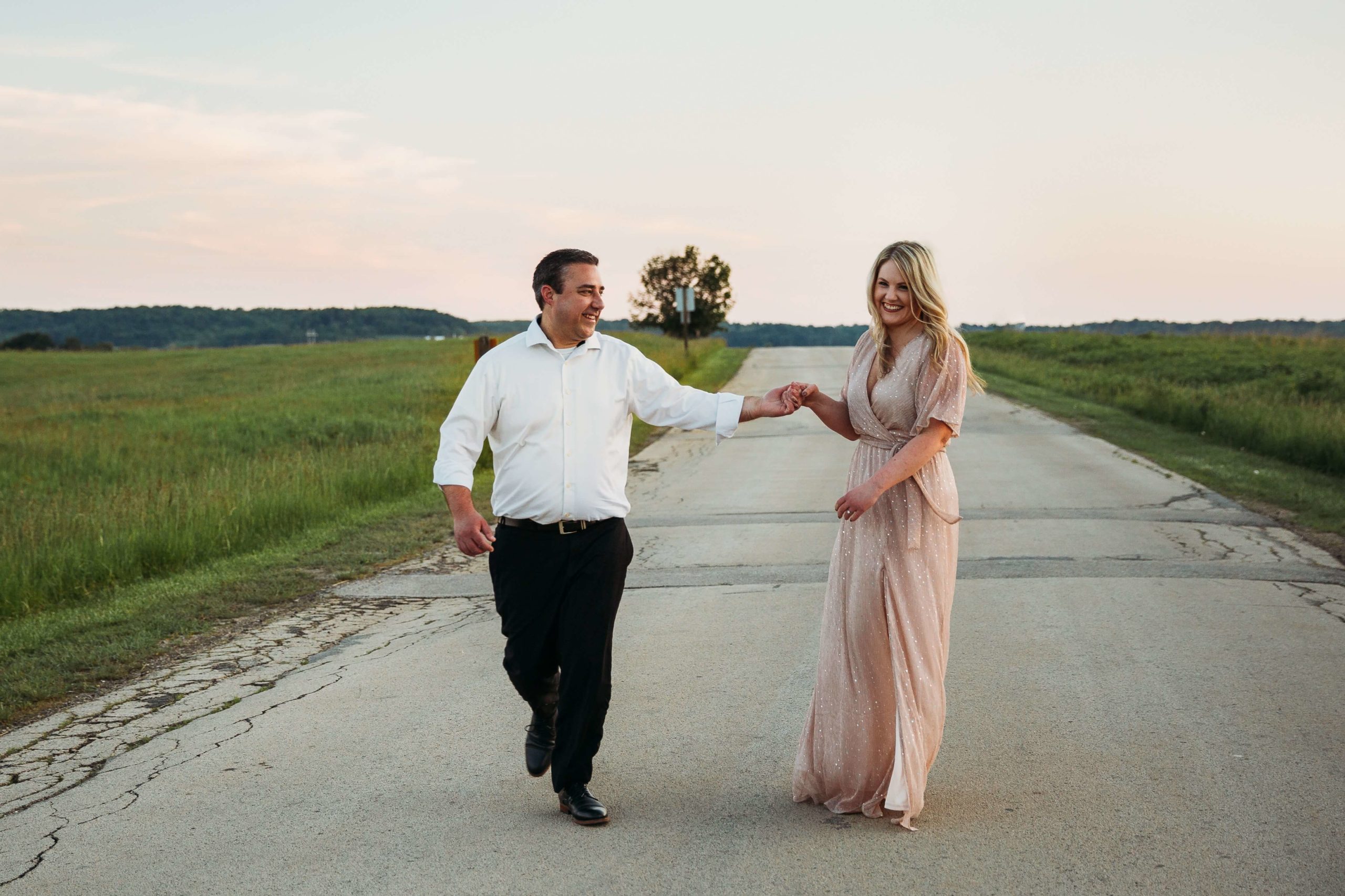 couple walking and laughing together during mines of spain engagement session