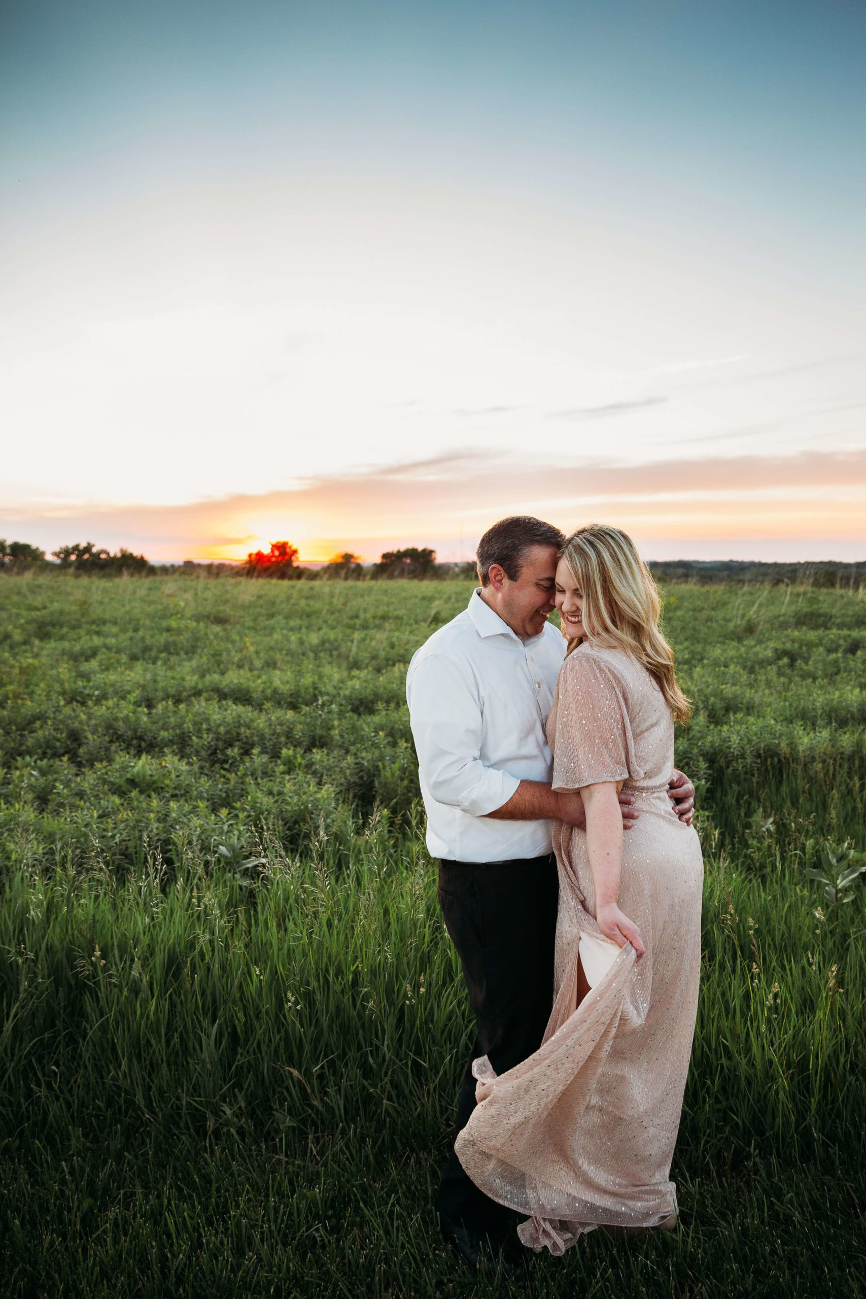 couple standing together at sunset during mines of spain engagement session
