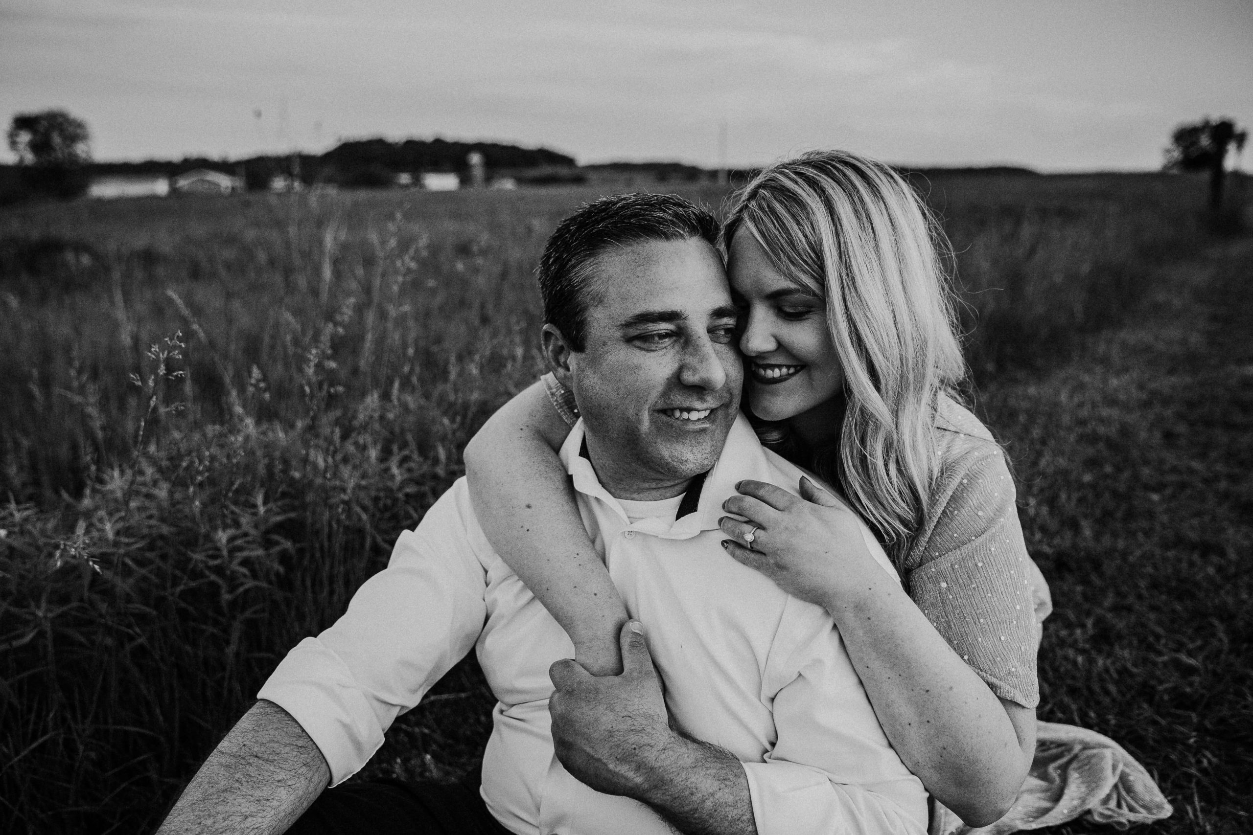 black and white photo of a dubuque couple snuggling during their engagement session