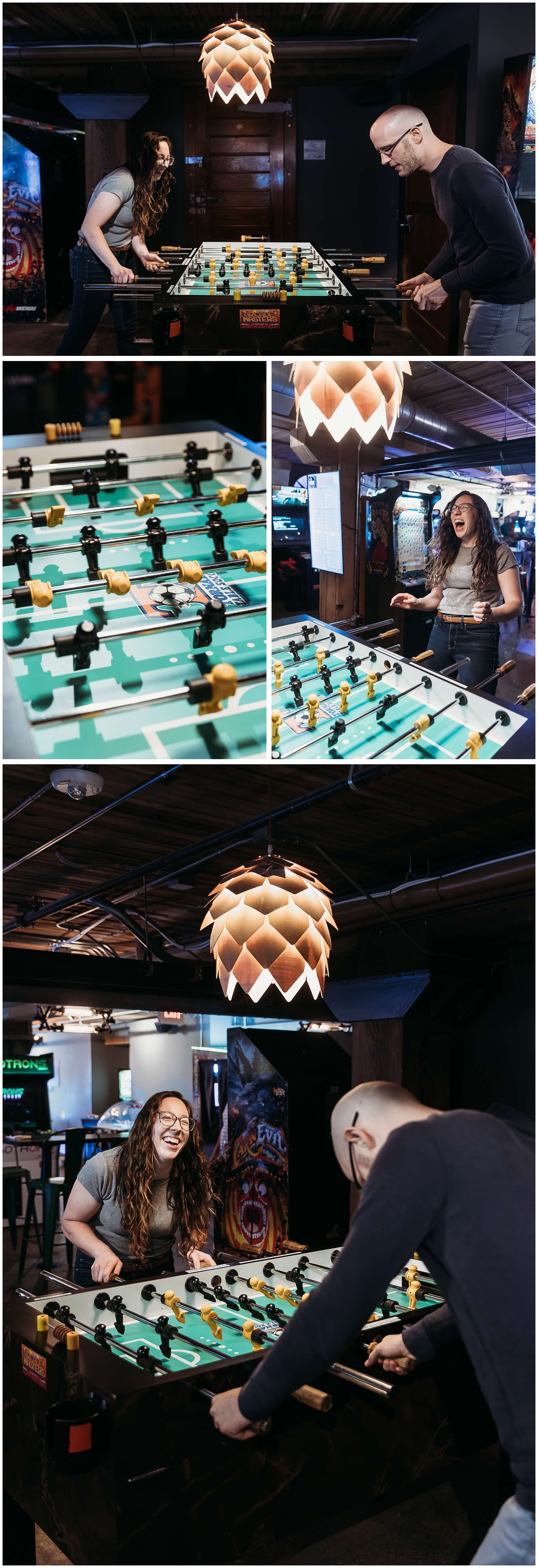 couple plays foosball during engagement photos at backpocket brewery dubuque